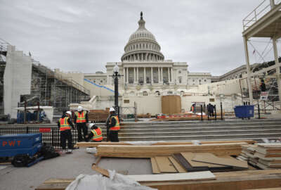 Construction continues on the Inaugural platform in preparation for the Inauguration and swearing-in ceremonies for President-elect Donald Trump, Thursday, Dec. 8, 2016, on the Capitol steps in Washington. Trump will be sworn in a president on Jan. 20, 2017. (AP Photo/Pablo Martinez Monsivais)
