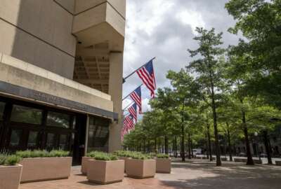 In this photo taken Aug. 19, 2015, the J. Edgar Hoover Building, The Federal Bureau of Investigation headquarters in Washington. The U.S. has released its most detailed report yet on accusations that Russia interfered in the U.S. presidential election by hacking American political sites and email accounts. The 13-page joint analysis by the Department of Homeland Security and the FBI is the first such report ever to attribute malicious cyber activity to a particular country or actors.  (AP Photo/Andrew Harnik)
