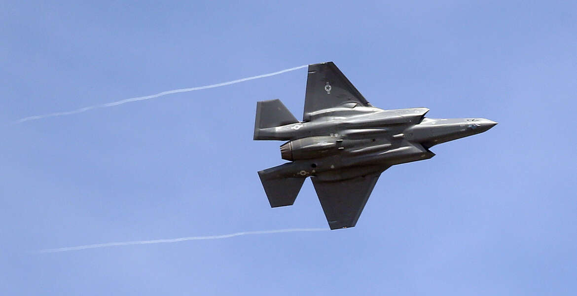 FILE - In this Wednesday, Sept. 2, 2015, file photo, an F-35 jet arrives at its new operational base at Hill Air Force Base, in northern Utah. Shares of Lockheed Martin fell Monday, Dec. 12, 2016, as President-elect Donald Trump tweeted that making F-35 fighter planes is too costly and that he will cut 