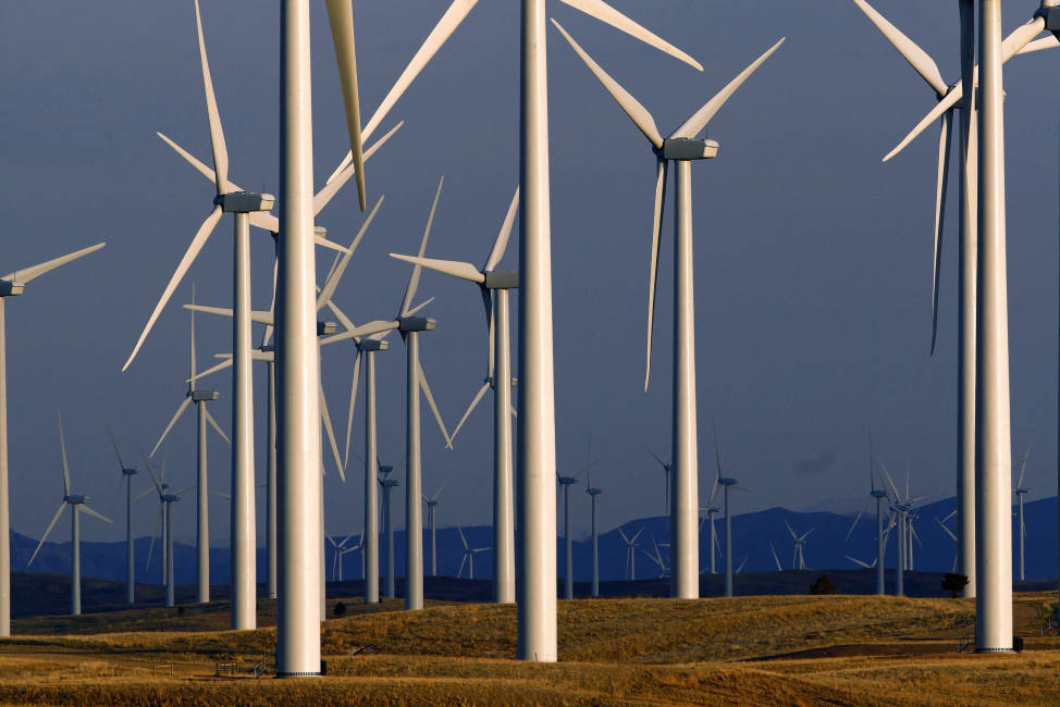 FILE - In this May 6, 2013, file photo, a wind turbine farm stands near Glenrock, Wyo. Renewable energy developers say they are hopeful about the future despite President-elect Donald Trump's promise to bring coal mining jobs back. In recent years, huge solar and wind farms have sprouted up on public desert land in the Western United States buoyed by generous federal tax credits. (AP Photo/Matt Young, File)