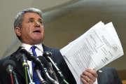 House Homeland Security Committee Chairman Rep. Michael McCaul, R-Texas speaks to reporters on Capitol Hill in Washington, Friday, Jan. 8, 2016, about the arrest of two Iraqi-born men who came to the U.S. as refugees and were indicted on terrorism-related charges by federal authorities. McCaul holds a copy of one of the indictments. (AP Photo/Susan Walsh)