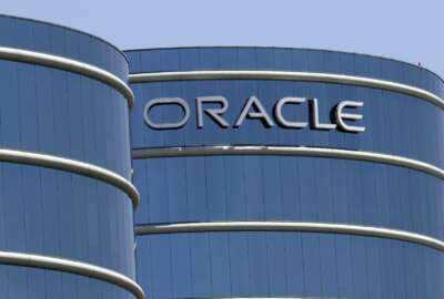 FILE - This June 18, 2012, file photo shows Oracle headquarters in Redwood City, Calif. The Labor Department is suing Oracle, claiming that the technology giant pays white male workers more than their non-white and female counterparts with the same job titles. In a statement issued Wednesday, Jan. 18, 2017, Oracle  called the lawsuit 