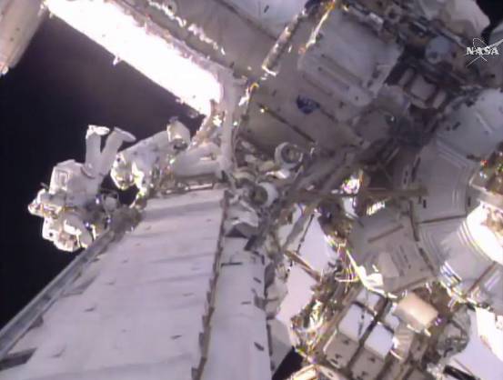 This still image taken from video provided by NASA shows U.S. astronaut Shane Kimbrough, left and  French astronaut Thomas Pesquet during a space walk outside the International Space Station, Friday, Jan. 13, 2017.  The astronauts are taking another spacewalk to plug in new and better batteries outside the space station. It's the same type of job conducted last Friday. Pesquet is the first French spacewalker in 15 years.  (NASA via AP)