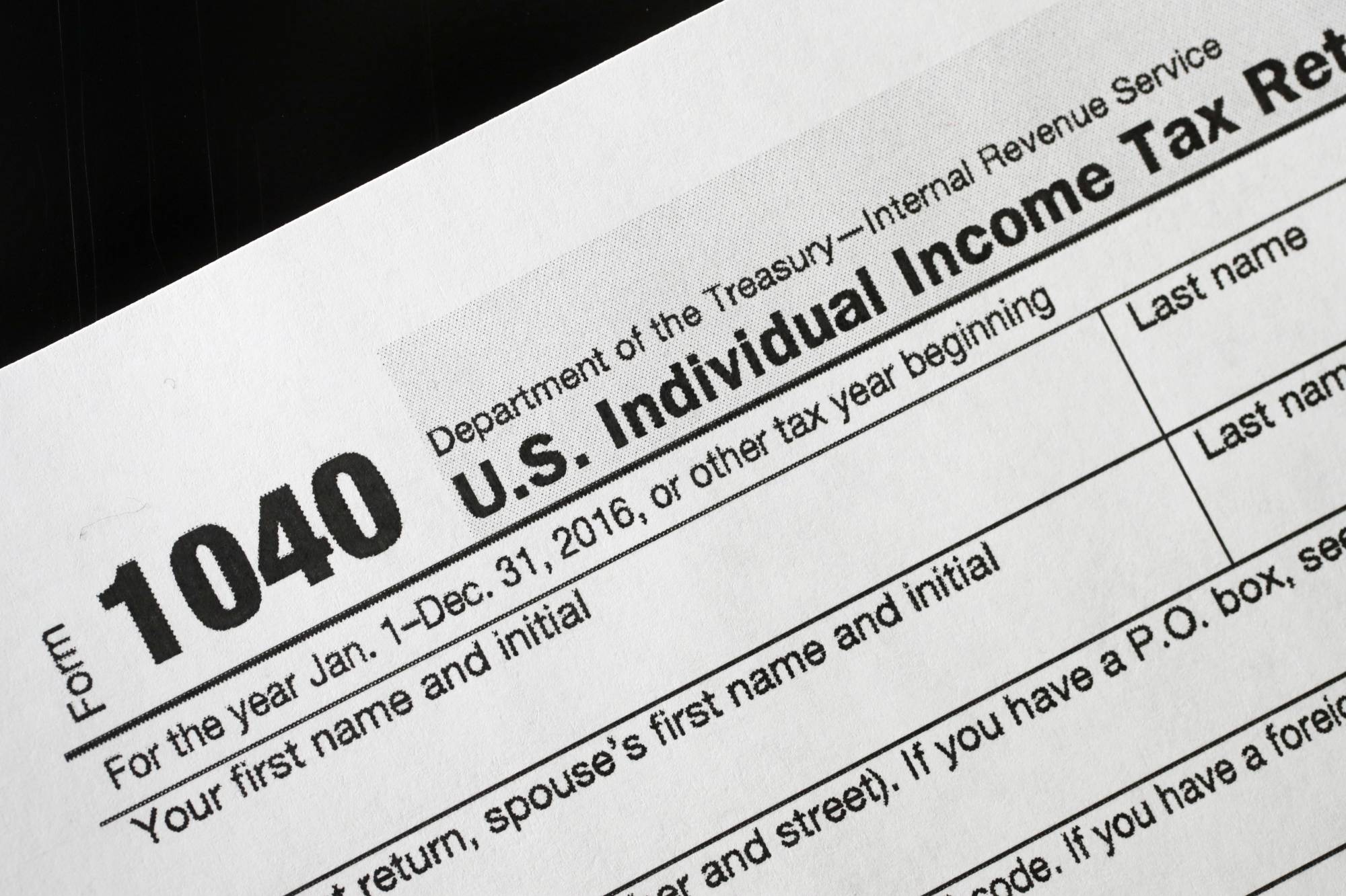 A 1040 tax form appears on display, Tuesday, Jan. 10, 2017, in New York. The IRS is delaying tax refunds for millions of low-income families as the agency steps up efforts to combat identity theft and fraud. Starting in 2017, a federal law requires the tax agency to delay refunds until Feb. 15 for people who claim the earned income tax credit and the additional child tax credit. The IRS says processing times will delay most of the refunds until the end of February. (AP Photo/Mark Lennihan)