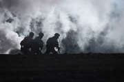 Marines assigned to Charlie Company, 1st Battalion, 3rd Marine Regiment, sprint through smoke during Integrated Training Exercise (ITX) 2-17 at Range 230, aboard Marine Corps Air Ground Combat Center, Twentynine Palms, California, Jan. 30, 2017. ITX is a combined-arms exercise which gives all elements of the Marine Air Ground Task Force an opportunity to utilize capabilities during large scale missions to become a more ready fighting force. 1/3 is currently participating as the ground combat element for this exercise. (U.S. Marine Corps photo by Cpl. Aaron S. Patterson/Released)