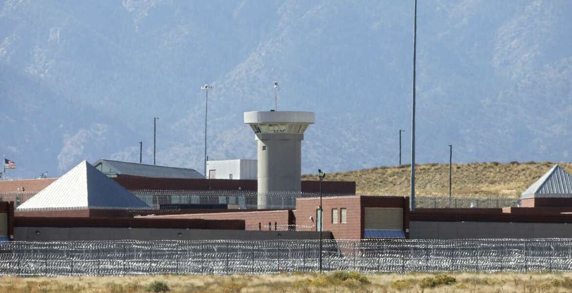 FILE - In this Oct. 15, 2015 file photo, a guard tower looms over a federal prison complex which houses a Supermax facility outside Florence, in southern Colorado. The federal prison population is on the decline, but a new attorney general who talks tough on drugs and crime could usher in a reversal of that trend. The resources of a prison system that for years has grappled with overcrowding, but that experienced a population drop as Justice Department leaders pushed a different approach to drug prosecutions, could again be taxed.  (AP Photo/Brennan Linsley,File)