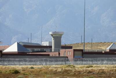 FILE - In this Oct. 15, 2015 file photo, a guard tower looms over a federal prison complex which houses a Supermax facility outside Florence, in southern Colorado. The federal prison population is on the decline, but a new attorney general who talks tough on drugs and crime could usher in a reversal of that trend. The resources of a prison system that for years has grappled with overcrowding, but that experienced a population drop as Justice Department leaders pushed a different approach to drug prosecutions, could again be taxed.  (AP Photo/Brennan Linsley,File)