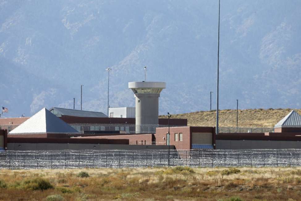 FILE - In this Oct. 15, 2015 file photo, a guard tower looms over a federal prison complex which houses a Supermax facility outside Florence, in southern Colorado. The federal prison population is on the decline, but a new attorney general who talks tough on drugs and crime could usher in a reversal of that trend. The resources of a prison system that for years has grappled with overcrowding, but that experienced a population drop as Justice Department leaders pushed a different approach to drug prosecutions, could again be taxed.  (AP Photo/Brennan Linsley,File)