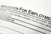 FILE - This April 22, 2014, file photo shows an employment application form on a table during a job fair at Columbia-Greene Community College in Hudson, N.Y.  The Labor Department said Thursday, Feb. 23, 2017,  that 244,000 Americans applied for jobless aid last week, up by 6,000 from the previous week.(AP Photo/Mike Groll, File)