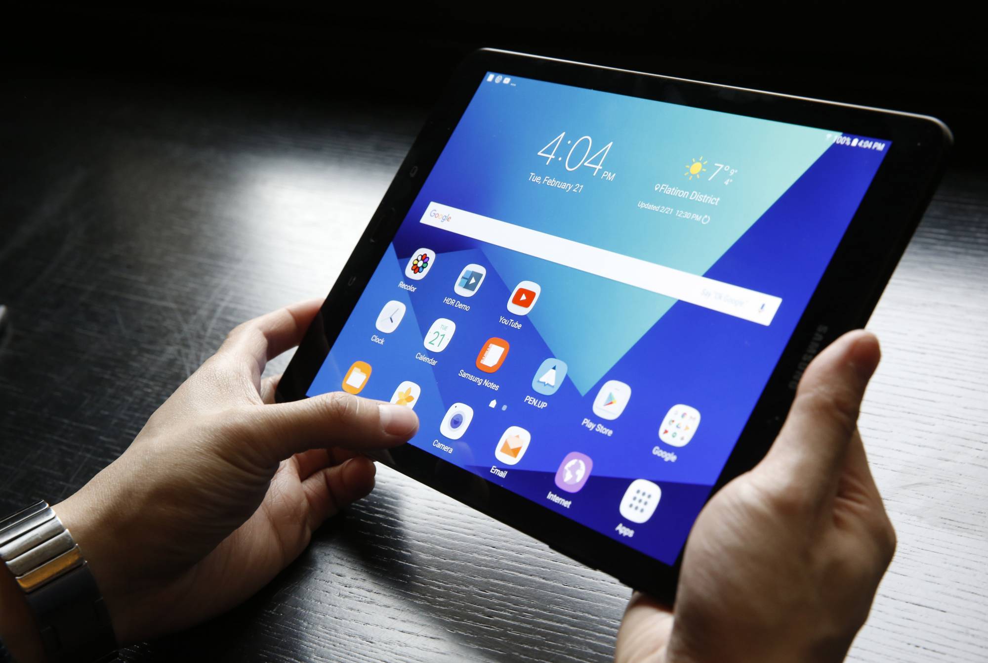 A user holds a Samsung Tab S3 Android tablet, Tuesday, Feb. 21, 2017, during a press briefing in New York. The new tablet will come with many of Samsung's fire-prone Note 7's features, including an S Pen stylus and a richly colored screen. (AP Photo/Kathy Willens)