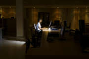 Woman Working in Dark Office