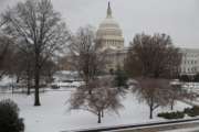 Snow covers Capitol Hill in Washington, early Tuesday, March, 14, 2017. A late-season storm is dumping a messy mix of snow, sleet and rain on the mid-Atlantic, complicating travel, knocking out power and closing schools and government offices around the region. (AP Photo/J. Scott Applewhite)