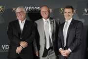 FILE - In this April 13, 2017, file photo, Vegas Golden Knights coach Gerard Gallant is flanked by Bill Foley, left, owner of the Vegas Golden Knights, and George McPhee, Vegas Golden Knights general manager, in Las Vegas. Vegas Golden Knights general manager George McPhee certainly wouldn't mind some Lady Luck to rub off on his NHL expansion franchise when it comes to how the balls drop in the league's draft lottery on Saturday.  (AP Photo/John Locher, File)