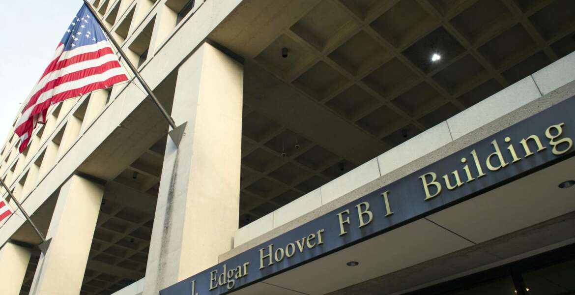 FILE - In this Nov. 2, 2016, file photo, the FBI's J. Edgar Hoover headquarter building in Washington. The FBI has been reviewing the handling of thousands of terror-related tips and leads received over the last three years to make sure they were properly investigated and that no obvious red flags were missed, The Associated Press has learned. (AP Photo/Cliff Owen, File)