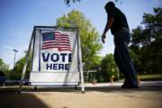 A voter leaves a polling site after casting a ballot in a special election in Marietta, Ga., Tuesday, April 18, 2017. Republicans are bidding to prevent a major upset in a conservative Georgia congressional district Tuesday where Democrats stoked by opposition to President Donald Trump have rallied behind a candidate who has raised a shocking amount of money for a special election. (AP Photo/David Goldman)