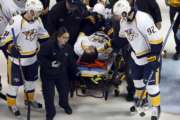 Nashville Predators' Ryan Johansen (92) and Viktor Arvidsson, left, of Sweden, offer encouragement to teammate Kevin Fiala, of Switzerland, as Fiala is taken off on a stretcher after being injured during the second period in Game 1 of an NHL hockey second-round playoff series against the St. Louis Blues, Wednesday, April 26, 2017, in St. Louis. (AP Photo/Jeff Roberson)