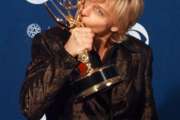 FILE - In this Sept. 14, 1997 file photo, Ellen DeGeneres kisses her Emmy backstage at the 49th Annual Primetime Emmy Awards in Pasadena, Calif. DeGeneres won the Emmy for outstanding writing in a comedy series for "Ellen." It was 20 years ago that Ellen DeGeneres made history as the first prime-time lead on network TV to come out of the closet. The episode was watched by a staggering 44 million viewers. It won an Emmy for writing, a Peabody as a landmark in broadcasting and numerous other accolades. (AP Photo/Kevork Djanzezian, File)