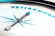 Compass with needle pointing the word retirement, concept image to illustrate retirement planning