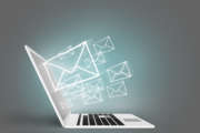 Email concept with laptop on the gray backround