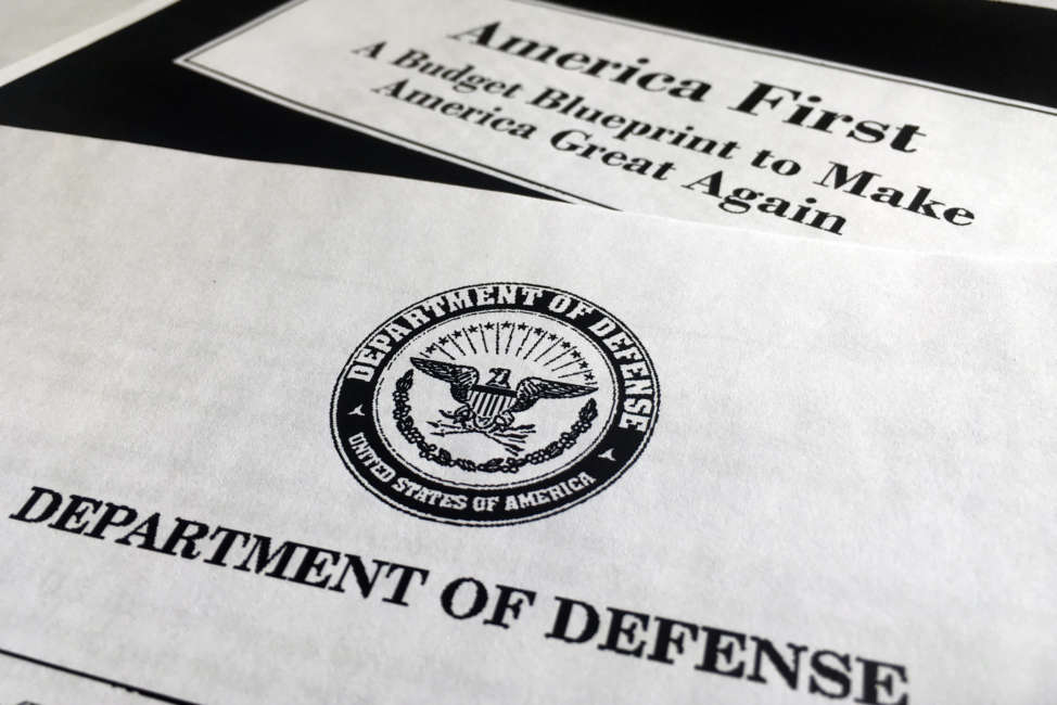 A portion of President Donald Trump's first proposed budget, focusing on the Department of Defense, and released by the Office of Management and Budget, is photographed in Washington, Wednesday, March 15, 2017. President Donald Trump is unveiling a $1.15 trillion budget, a far-reaching overhaul of federal government spending that slashes a dozen departments to finance a significant increase in the military and make a down payment on a U.S.-Mexico border wall. (AP Photo/Jon Elswick)