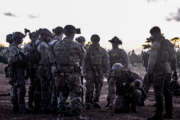 

Airmen from the 320th Special Tactics Squadron gather around their team lead outside a shoot house as he discusses details of an upcoming mission Nov. 19, 2015, at Camp Hansen, Japan. Extensive planning and coordination is put into special tactics operations in order to maximize mission effectiveness and safety. (U.S. Air Force photo/Senior Airman John Linzmeier)