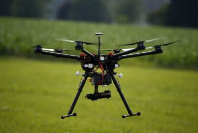 FILE - In this June 11, 2015, file photo, a hexacopter drone is flown during a drone demonstration in Cordova, Md. An appeals court has struck down a Federal Aviation Administration rule that required owners to register drones used for recreation.  (AP Photo/Alex Brandon, File)