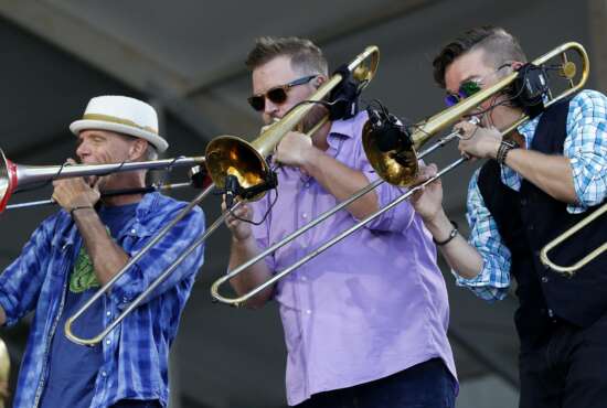 The brass funk rock band Bonerama performs at the New Orleans Jazz and Heritage Festival in New Orleans, Friday, May 5, 2017. (AP Photo/Gerald Herbert)