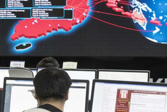 In this Monday, May 15, 2017, file photo, employees watch electronic boards to monitor possible ransomware cyberattacks at the Korea Internet and Security Agency in Seoul, South Korea. A couple of things about the WannaCry cyberattack are now pretty certain. It was the biggest in history and it’s a scary preview of things to come _ we’re all going to have to get used to hearing the word “ransomware.” But one thing is a lot less clear: whether North Korea had anything to do with it. (Yun Dong-jin/Yonhap via AP, File)