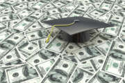 Mini graduation cap on US money -- education costs in the design of information related to the cost of education