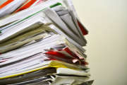 Stack of files on his desk