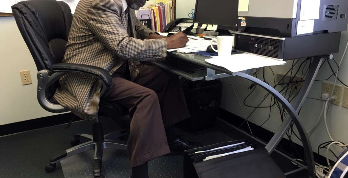 In this May 18, 2017, photo, Nathan Singletary, 67, a social worker for 40 years, fills out paperwork at the AARP Foundation in Harrisburg, Pa. Singletary is beyond the traditional retirement age, but he’s only just beginning a new career - helping other low-income, unemployed Americans over age 55 find jobs. Singletary got his job through the half-century-old Senior Community Service Employment Program, a training and placement program underwritten by taxpayers aimed at putting older Americans back into the workforce. (AP Photo/Laurie Kellman)