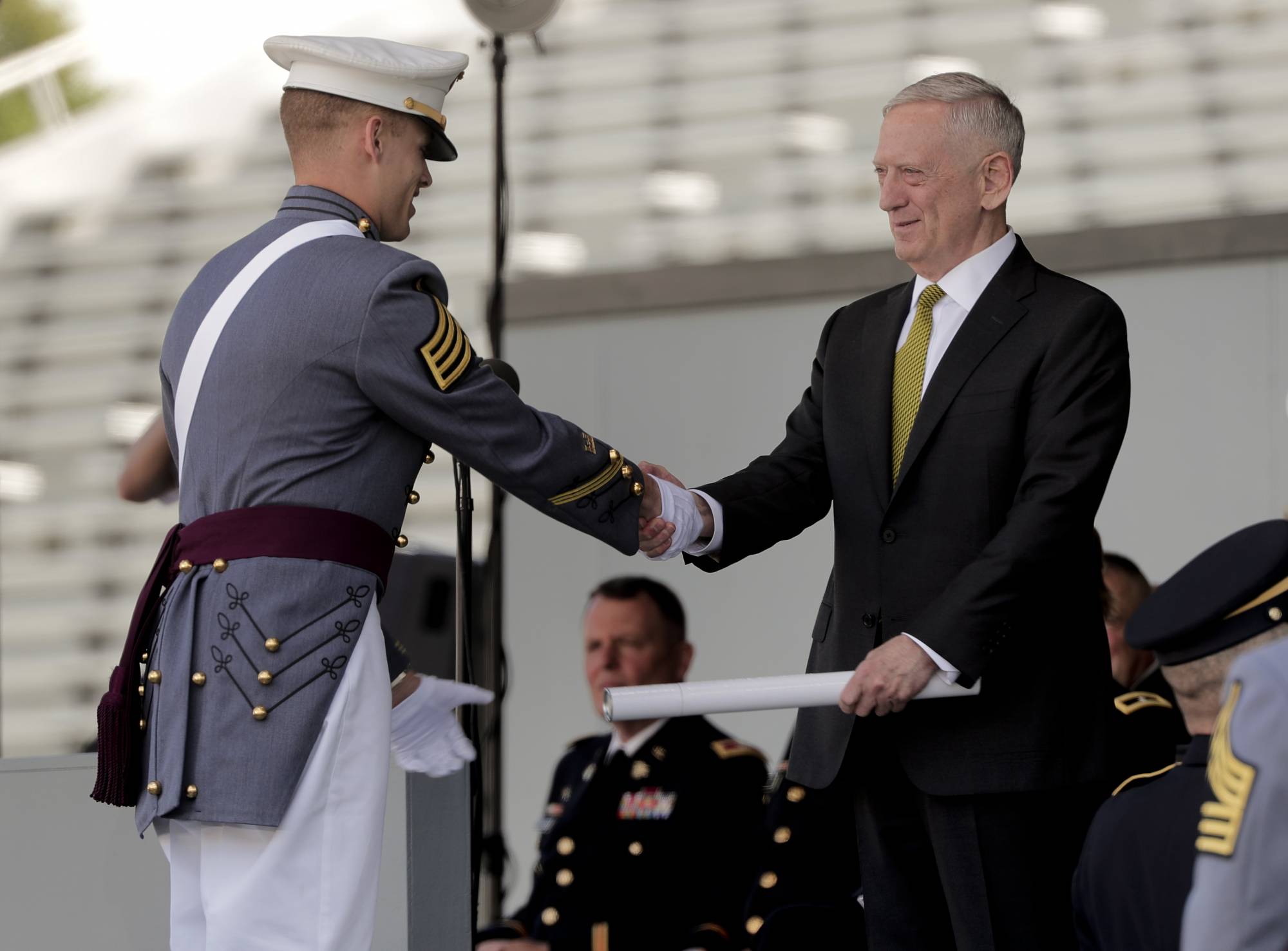 Secretary of Defense James Mattis hands a graduating cadet his diploma while congratulating him during commencement ceremonies at the United States Military Academy, Saturday, May 27, 2017, in West Point, N.Y. Nine Hundred and thirty six cadets received their diplomas, most of whom will be commissioned as second lieutenants in the army. (AP Photo/Julie Jacobson)