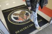 FILE - In this April 2, 2015, file photo, a visitor leaves the Sacramento Veterans Affairs Medical Center in Rancho Cordova, Calif. The number of veterans seeking health care but ending up on waiting lists of one month or more is 50 percent higher now than it was a year ago when a scandal over false records and long wait times wracked the Department of Veterans Affairs, The New York Times reported Saturday, June 20, 2015, online ahead of its Sunday editions. (AP Photo/Rich Pedroncelli, File)