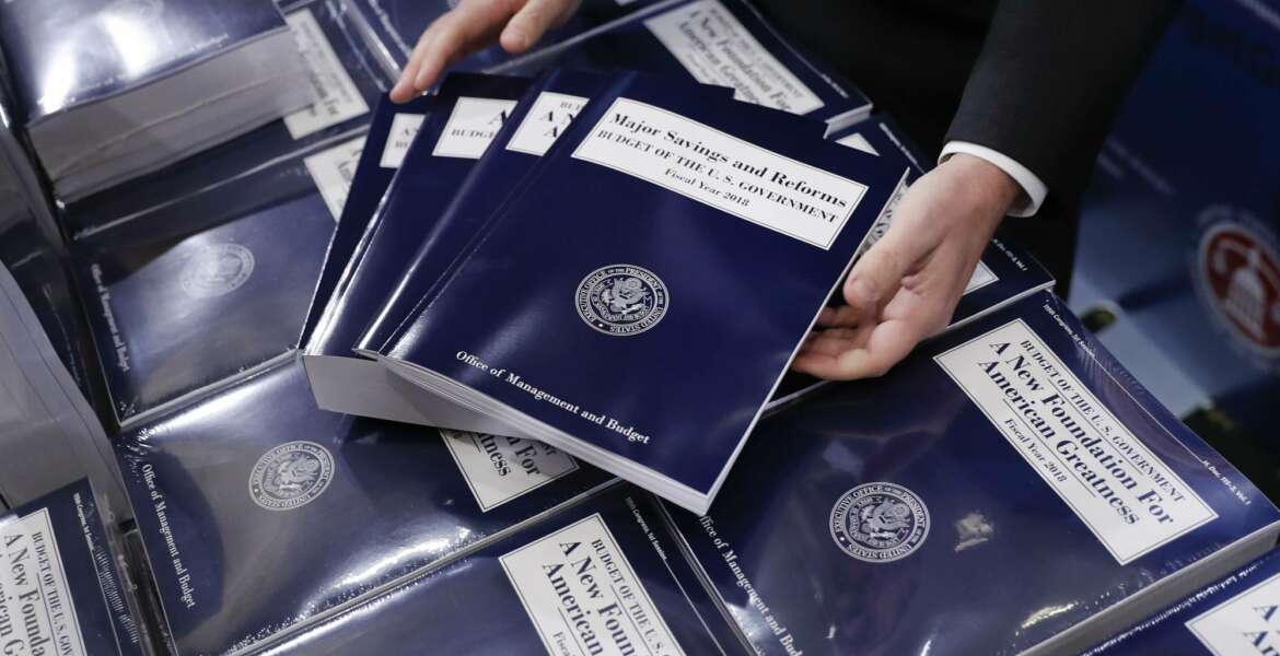FILE - In this May 23, 2017 file photo, copies of President Donald Trump's fiscal 2018 federal budget are seen on Capitol Hill in Washington. Even members of his own party last month were quick to declare President Donald Trump’s budget plan dead on arrival. And in fact, Congress faces a burst of overdue budget-related work this summer, most of which probably won’t bear much resemblance to Trump’s budget, which promised deep spending cuts on domestic programs, rapid economic growth, and a balanced federal ledger in a decade.  (AP Photo/Pablo Martinez Monsivais, File)