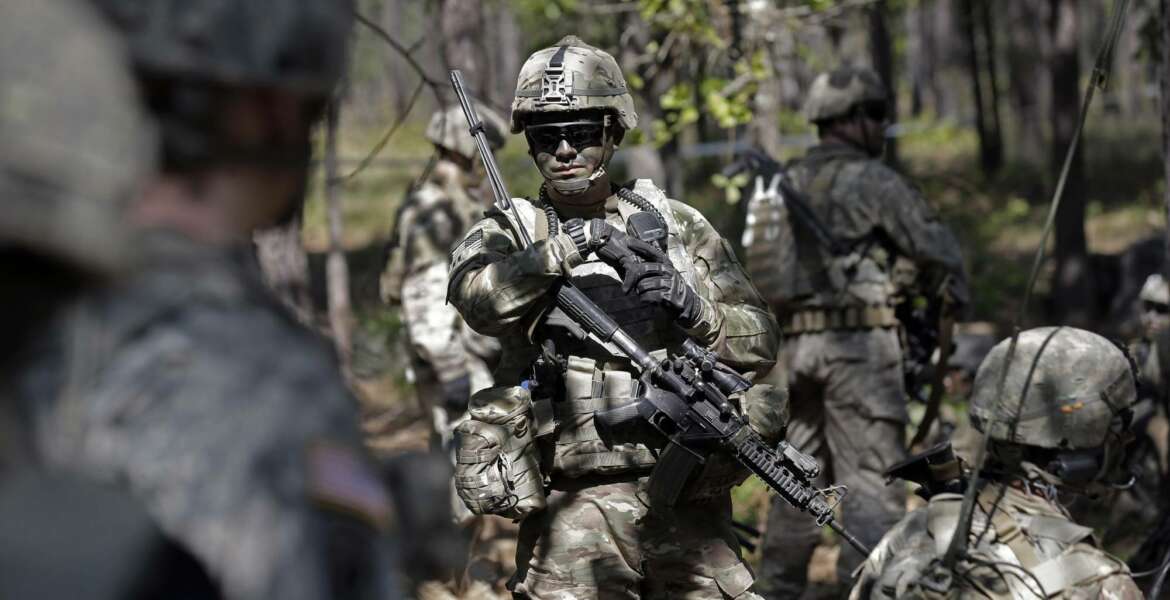 In this photo taken Friday, April 21, 2017 paratroopers with the 82nd Airborne Division's 3rd Brigade Combat Team participate in a training exercise at Fort Bragg, N.C. The Army is planning to triple the amount of bonuses it’s paying this year to more than $380 million in a bid to expand its ranks. The money includes new incentives to woo reluctant soldiers to re-enlist.  (AP Photo/Gerry Broome)