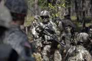 In this photo taken Friday, April 21, 2017 paratroopers with the 82nd Airborne Division's 3rd Brigade Combat Team participate in a training exercise at Fort Bragg, N.C. The Army is planning to triple the amount of bonuses it’s paying this year to more than $380 million in a bid to expand its ranks. The money includes new incentives to woo reluctant soldiers to re-enlist.  (AP Photo/Gerry Broome)