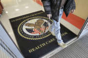 FILE - In this April 2, 2015, file photo, a visitor leaves the Sacramento Veterans Affairs Medical Center in Rancho Cordova, Calif. The number of veterans seeking health care but ending up on waiting lists of one month or more is 50 percent higher now than it was a year ago when a scandal over false records and long wait times wracked the Department of Veterans Affairs, The New York Times reported Saturday, June 20, 2015, online ahead of its Sunday editions. (AP Photo/Rich Pedroncelli, File)