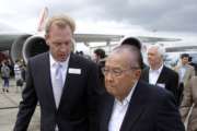 Boeing Vice President Patrick Shanahan, left, talks to U.S. Sen. Daniel Inouye, D-Hawaii, as they walk next to a Boeing 747-8 at the Paris Air Show, Le Bourget, east of Paris, Sunday, June 19, 2011. The Paris Air Show will open tomorrow on June 20 at Le Bourget. (AP Photo/Michel Euler)