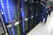 FILE - In this Oct. 15, 2013, file photo, Chuck Goolsbee, site director for Facebook's Prineville data centers, shows the computer servers that store users' photos and other data, at the Facebook site in Prineville, Ore. Facebook is making good on plans to expand its high-tech data center already under construction in central New Mexico. Gov. Susana Martinez's office announced early Tuesday, July 18, that the company will build a second building at the site near Los Lunas, just south of Albuquerque. (Andy Tullis/The Bulletin, via AP, File)