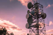 Communication and transmission tower for military use over a magenta sky