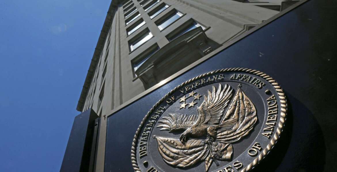 FILE - In this June 21, 2013, file photo, the seal affixed to the front of the Department of Veterans Affairs building in Washington. Congressional Republicans and Democrats have reached initial agreement on the biggest expansion of college aid for military veterans in a decade. It would remove a 15-year time limit to tap into benefits and boost money for thousands in the National Guard and Reserve.(AP Photo/Charles Dharapak, File)