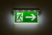 Emergency exit sign glowing in the dark