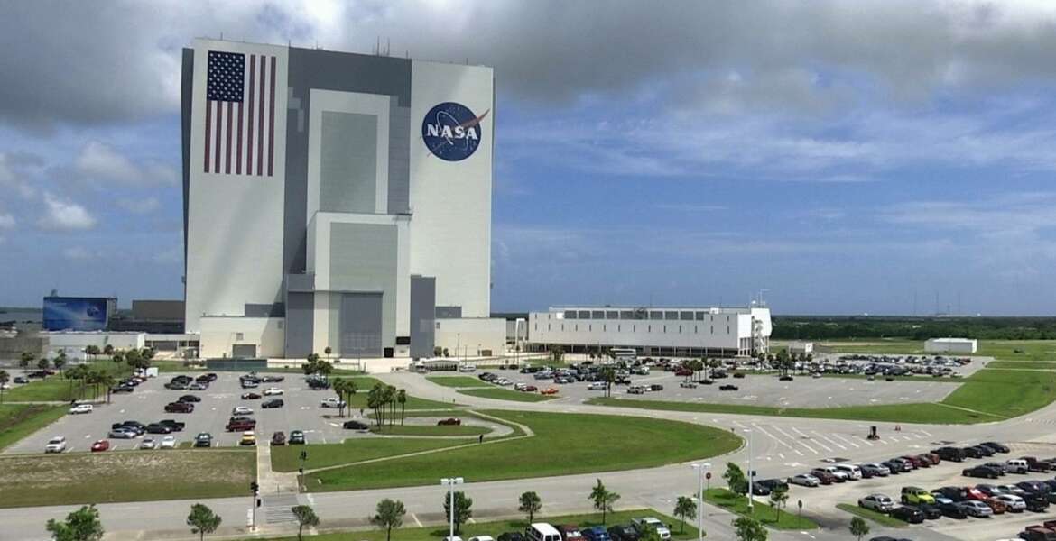 This July 14, 2017, photo shows the Vehicle Assembly Building at NASAs Kennedy Space Center in Cape Canaveral, Florida in Cape Canaveral, Fla. NASA says it may soon have the capability to send astronauts to the International Space Station from U.S. soil for the first time since the retirement of the space shuttle in 2011. (AP Photo/Alex Sanz)