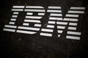 FILE - In this April 26, 2017, file photo, the IBM logo is displayed on the IBM building in Midtown Manhattan, in New York. In a judge's ruling dated Friday, Aug. 4, 2017, IBM Corp. owes the state of Indiana $78 million in damages stemming from the company's failed effort to automate much of Indiana's welfare services. Indiana and IBM sued each other in 2010 after then-Gov. Mitch Daniels canceled the company's $1.3 billion contract. (AP Photo/Mary Altaffer, File)