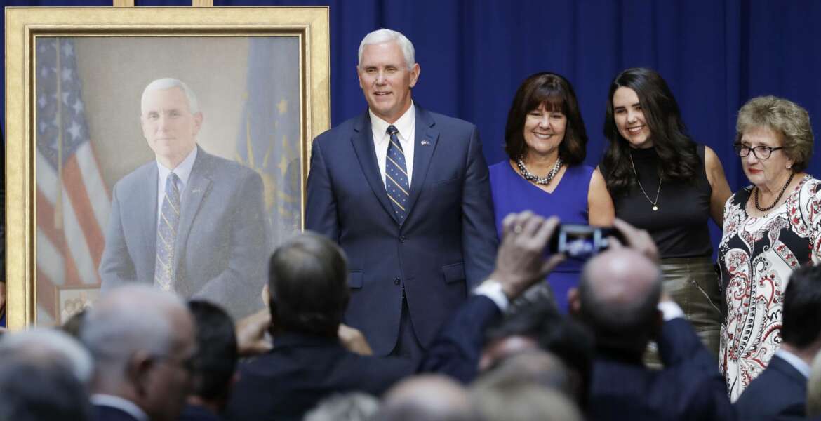 Vice President Mike Pence poses for a photo with is family, mother Nancy Pence-Fritsch, right, Karen Pence and Audrey Pence after the unveiling of his official state portrait, Friday, Aug. 11, 2017, in Indianapolis. (AP Photo/Darron Cummings)