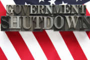 USA flag with government shutdown in metal type