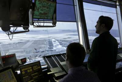 In this March 16, 2017 photo, air traffic controllers work in the tower at John F. Kennedy International Airport in New York. President Donald Trump has embraced airlines’ decades-long goal of removing air traffic control operations from the government and putting industry in charge, making it a key part of his agenda to boost the nation’s infrastructure through privatization. And yet, his prospects for closing the deal with Congress appear slim.  (AP Photo/Seth Wenig)