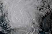 In this geocolor GOES-16 satellite image taken Sunday, Sept. 10, 2017, at 22:00 UTC, the eye of Hurricane Irma moves up Florida's west coast. Hurricane Irma gave Florida a coast-to-coast pummeling with winds up to 130 mph Sunday, swamping homes and boats, knocking out power to millions and toppling massive construction cranes over the Miami skyline. (NOAA via AP)