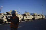 U.S. Army military vehicles stand after unloading in the port in Gdansk, Poland, Wednesday, Sept. 13, 2017. The equipment supply is a second heel-to-toe deployment of U.S. troops to the nation that is concerned for its security due to neighboring Russia's military activity. (AP Photo/Krzysztof Mystkowski)