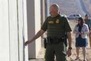 Ronald Vitiello, U.S. Customs and Border Protection’s acting deputy commissioner, feels prototypes of a border wall on Thursday, Oct. 26, 2017, in San Diego. Contractors have completed eight prototypes of President Donald Trump’s proposed border wall with Mexico, triggering a period of rigorous testing to determine if they can repel sledgehammers, torches, pickaxes and battery-operated tools. (John Gibbins/The San Diego Union-Tribune via AP, Pool)